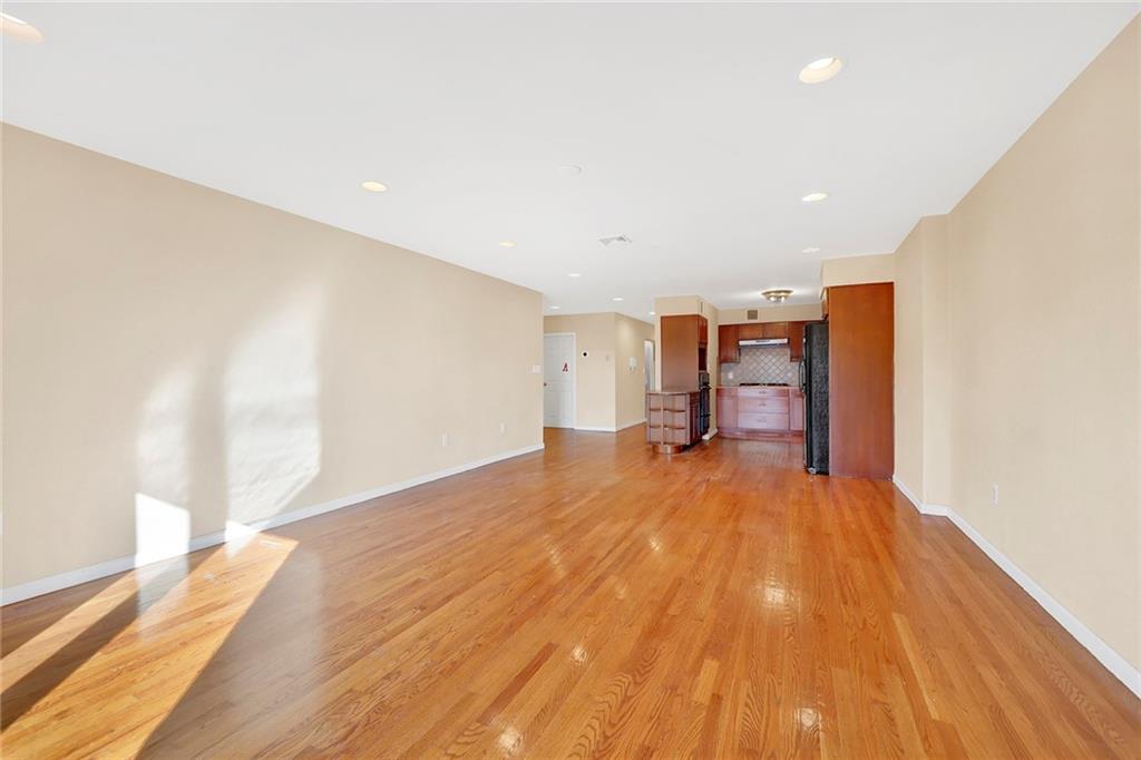 52 92nd Street, Unit 7C Brooklyn, NY 11209 - Photo 8 of 22 a view of empty room with wooden floor