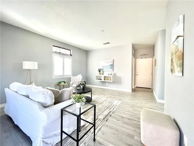 a living room with furniture and a table