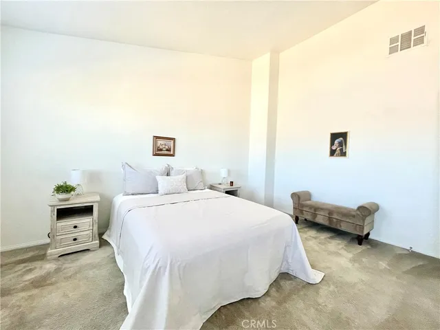 a bedroom with a bed and a cabinets