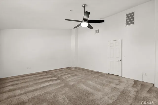 a view of a room with a fan