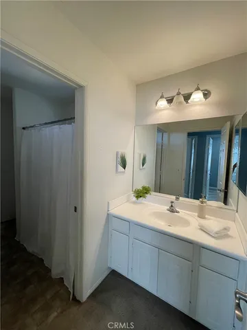 a bathroom with a sink and mirror