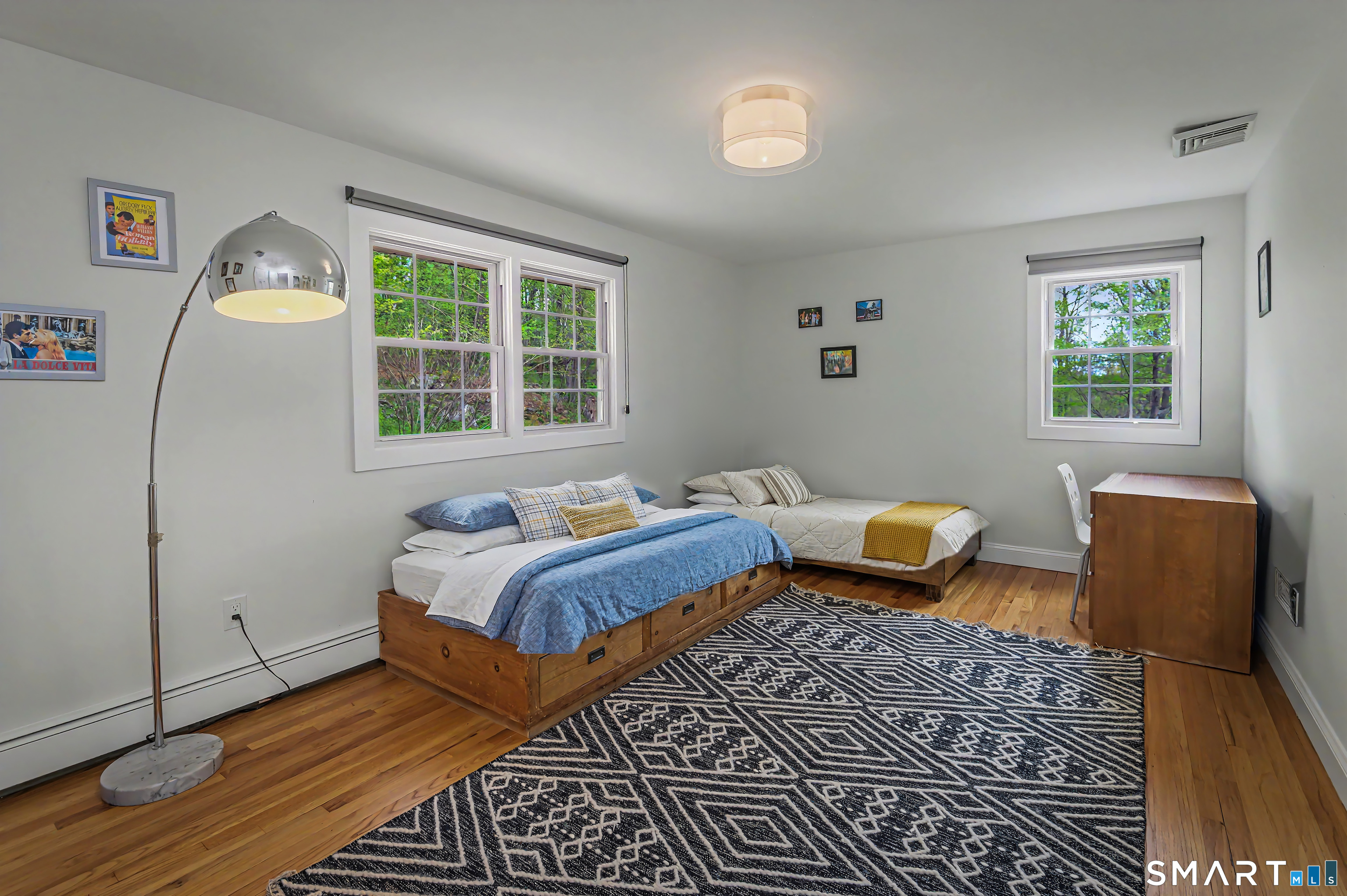 16 Twixt Hills Road Ridgefield, CT 06877 - Photo 18 of 25 a bedroom with a bed and wooden floor