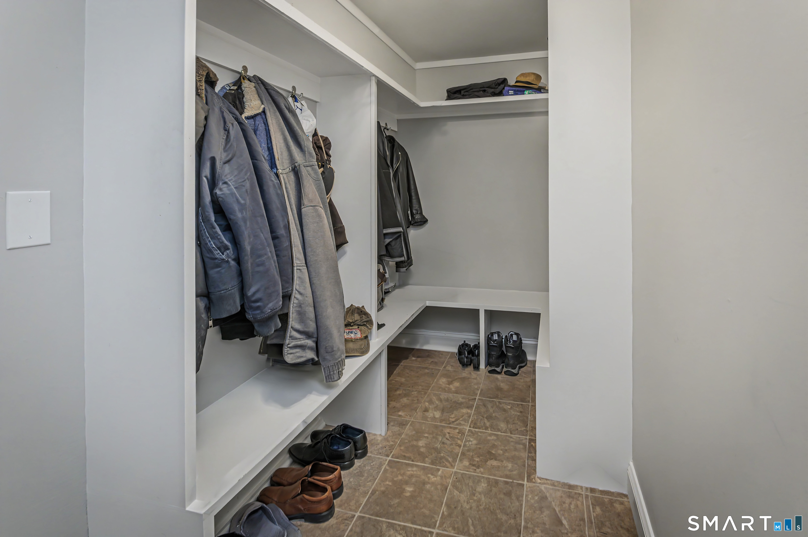 16 Twixt Hills Road Ridgefield, CT 06877 - Photo 21 of 25 a view of walk in closet with clothes and shoes