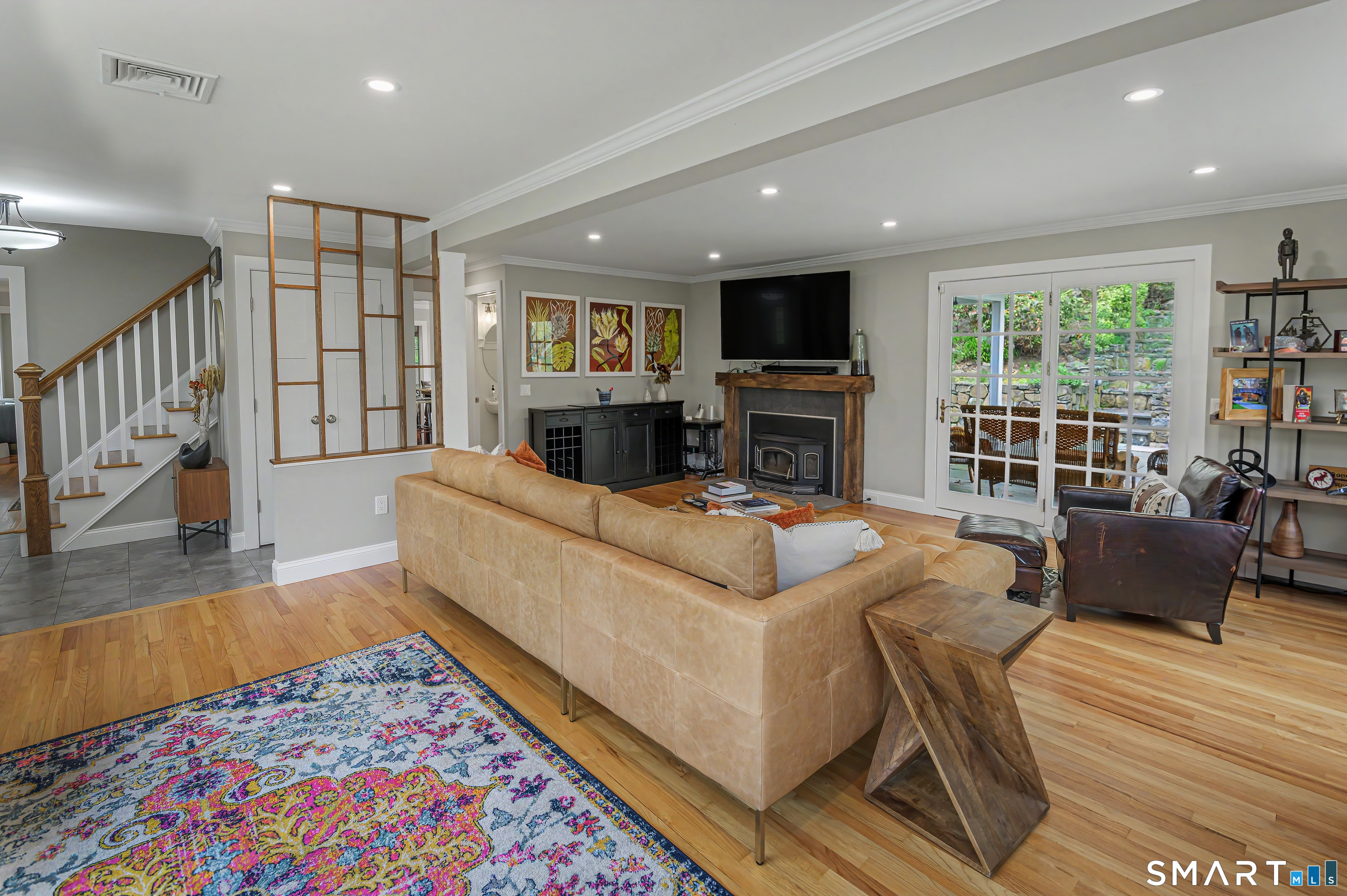 16 Twixt Hills Road Ridgefield, CT 06877 - Photo 4 of 25 a living room with furniture and a flat screen tv