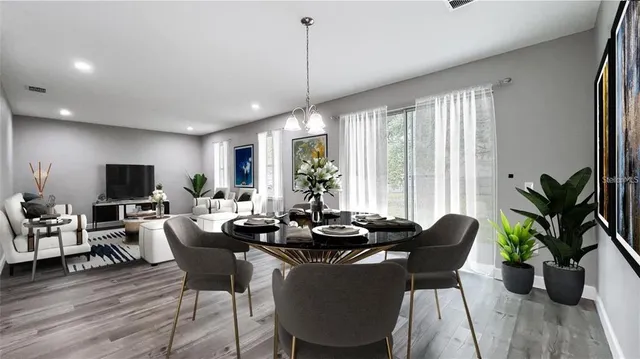 a view of a dining room with furniture window and wooden floor