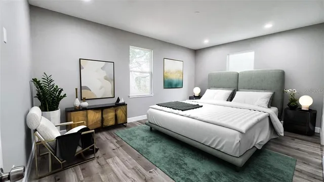 a bedroom with bed and window