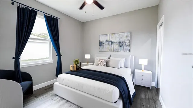 a bedroom with a bed and a window