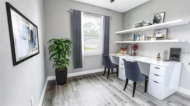 a workspace with furniture and window