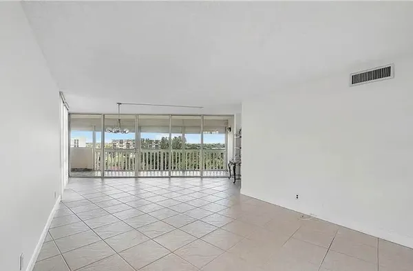 an empty room with sliding glass door