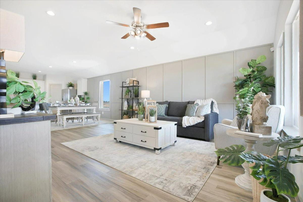 7415 8th Street Lubbock, TX 79416 - Photo 16 of 22 a living room with furniture and a large window
