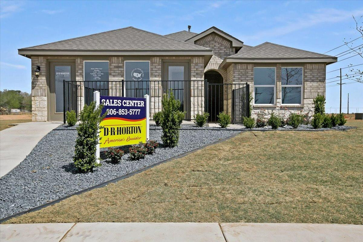 7415 8th Street Lubbock, TX 79416 - Photo 22 of 22 a front view of a house with garden