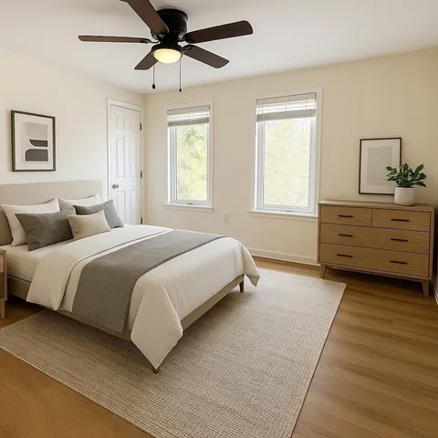 a bedroom with a bed and window