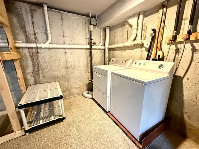a bathroom with a sink a toilet and a shower