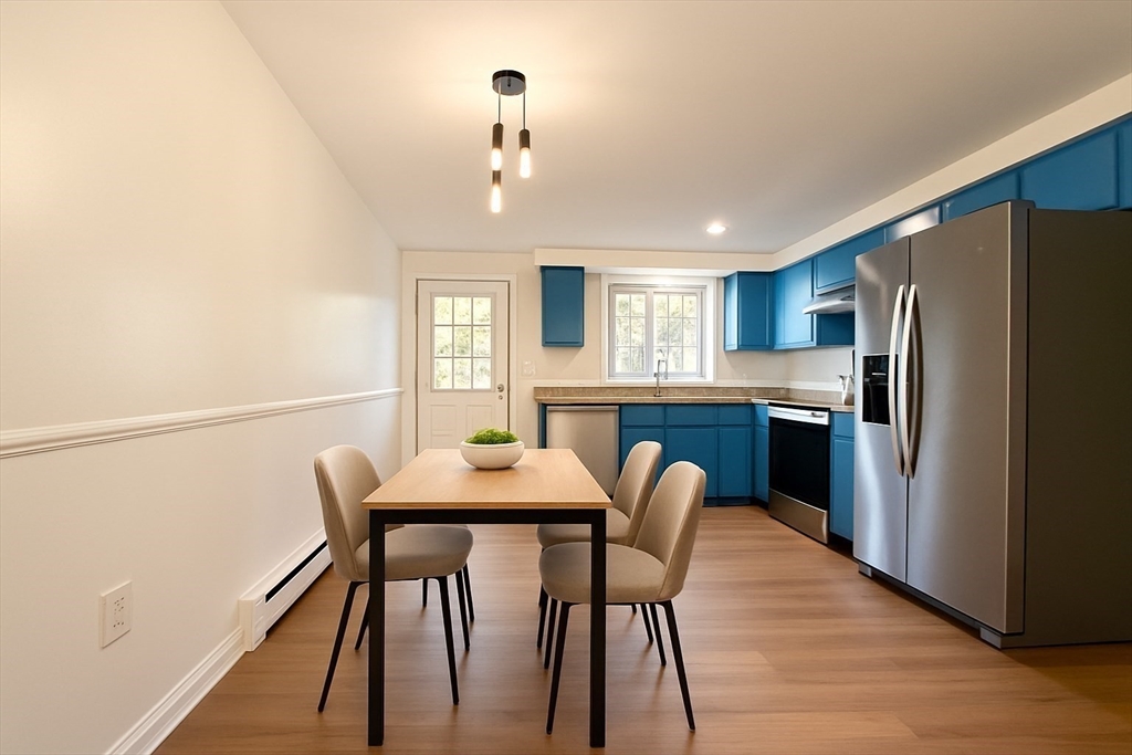 9 Olga Avenue, Unit 9 Worcester, MA 01605 - Photo 3 of 23 a view of a dining room with furniture and a chandelier
