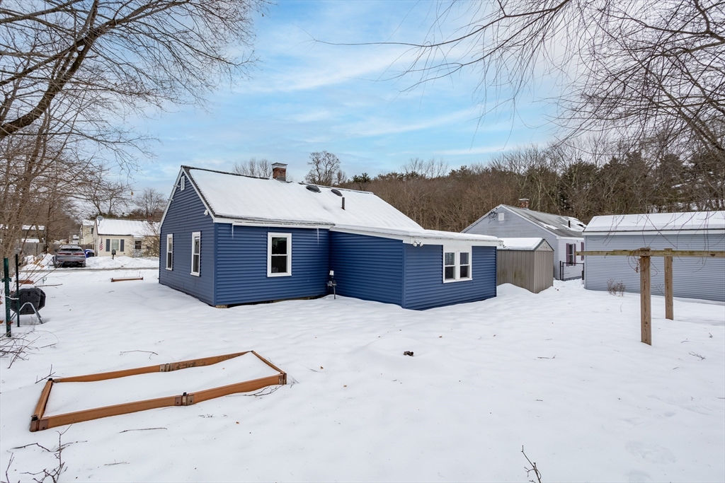 1 Bellevue Terrace Maynard, MA 01754 - Photo 26 of 30 a front view of a house with a yard covered in snow