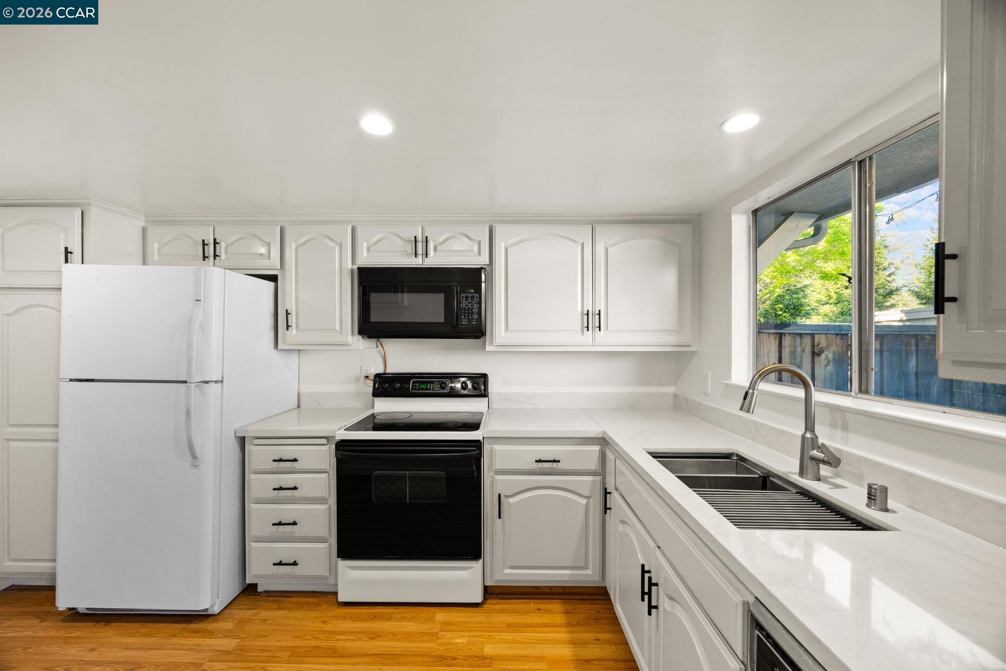 36 Miramonte Drive Moraga, CA 94556 - Photo 15 of 29 a kitchen with granite countertop a sink stove and refrigerator