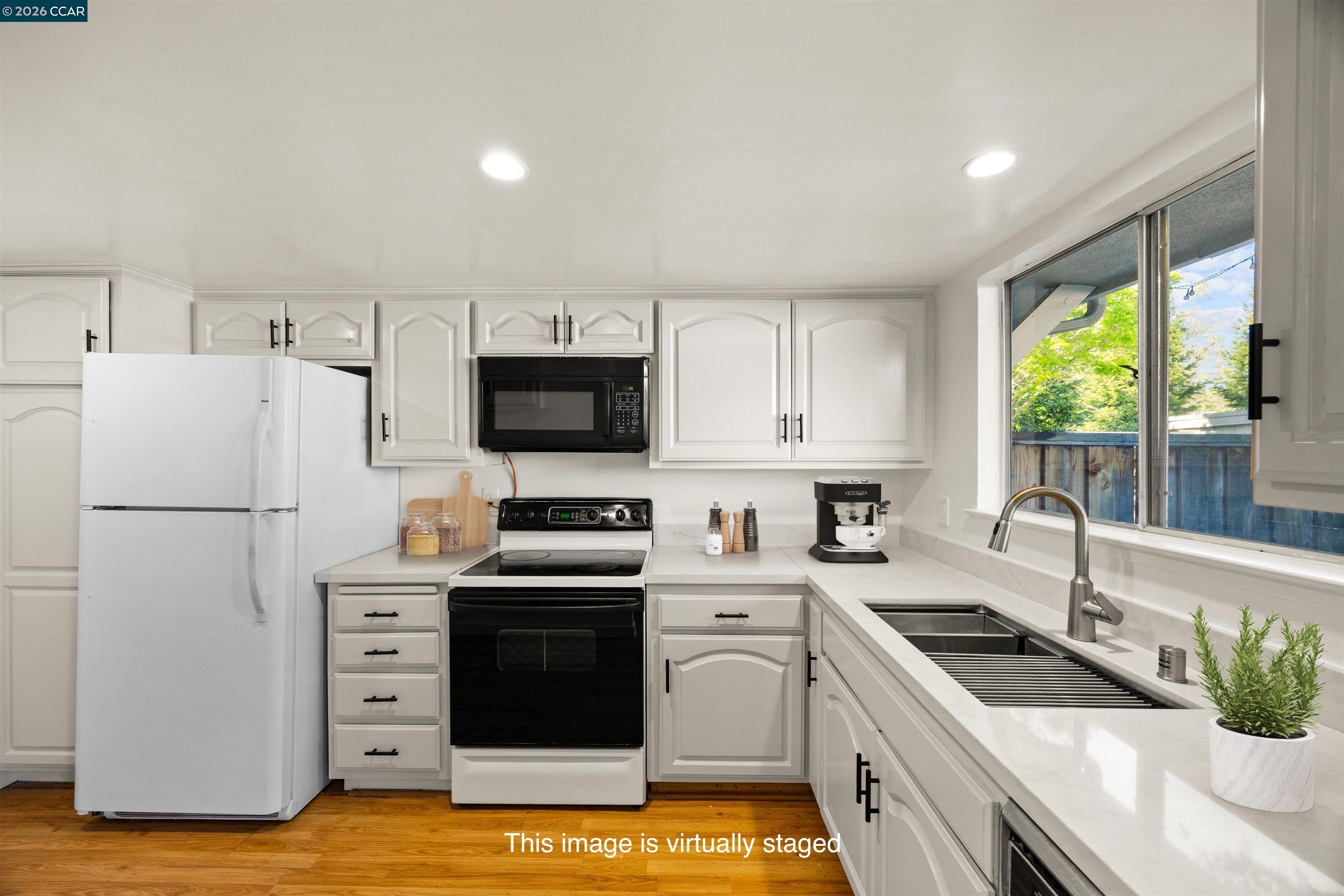 36 Miramonte Drive Moraga, CA 94556 - Photo 2 of 29 a kitchen with a stove a sink and a refrigerator