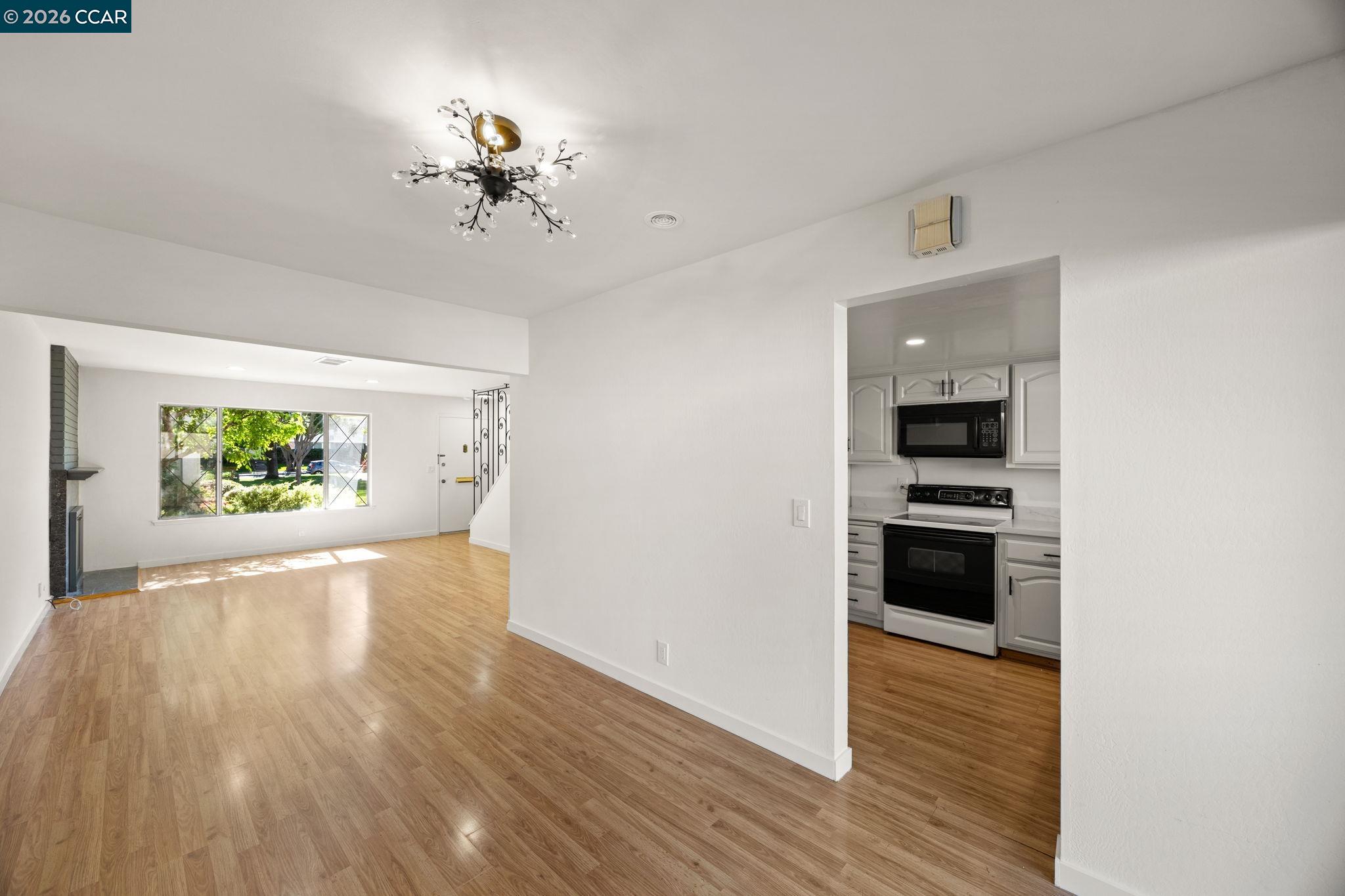 36 Miramonte Drive Moraga, CA 94556 - Photo 6 of 29 wooden floor in an empty room with a window