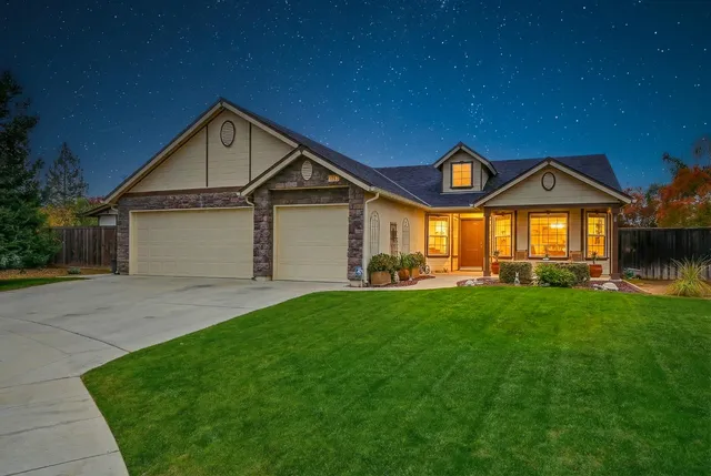 a front view of a house with a yard