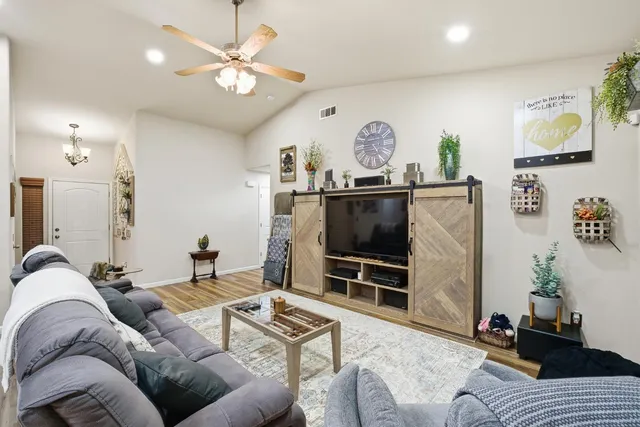 a bathroom with double vanity and a mirror