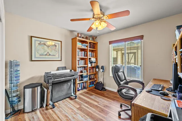 a view of a patio with a table and chairs
