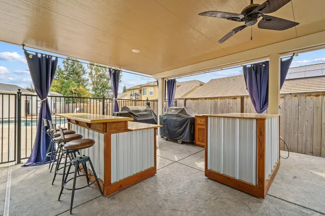 an aerial view of a house with a swimming pool