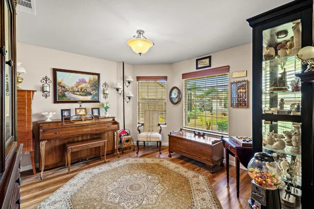 a kitchen with stainless steel appliances granite countertop a stove top oven a sink dishwasher and cabinets with wooden floor