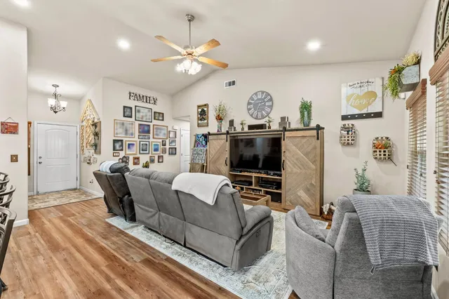 a kitchen with stainless steel appliances granite countertop a stove microwave and cabinets