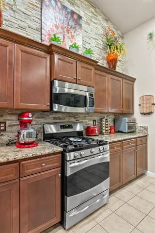 a spacious bathroom with a granite countertop tub sink and mirror