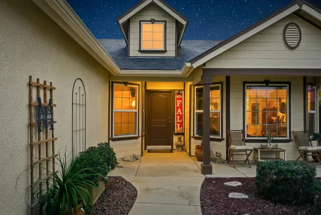 a view of a dining room with furniture wooden floor and chandelier
