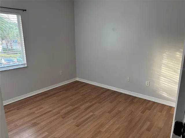 a white toilet sitting next to a bath tub
