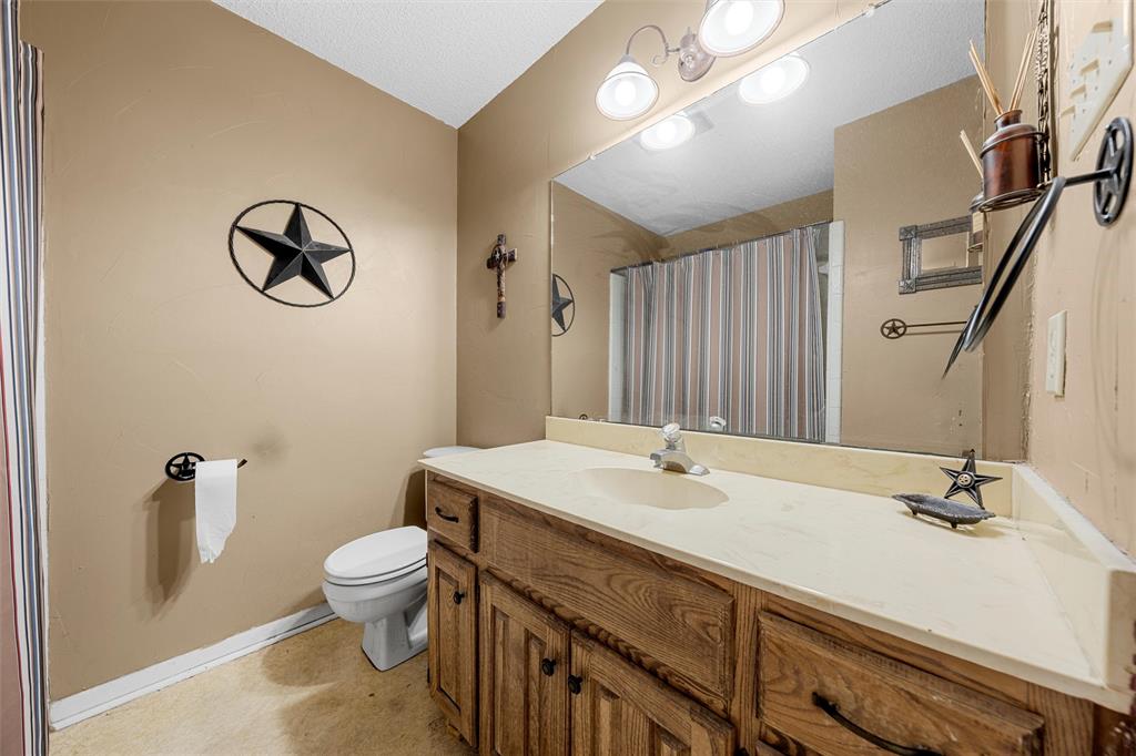 116 Boleman Drive Hewitt, TX 76643 - Photo 22 of 38 Bathroom with vanity and a shower with shower curtain