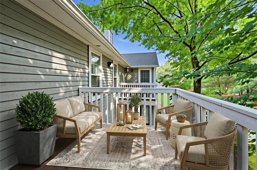 1007 Olde Mill Lane Norcross, GA 30093 - Photo 28 of 32 a view of a chair and tables in the balcony