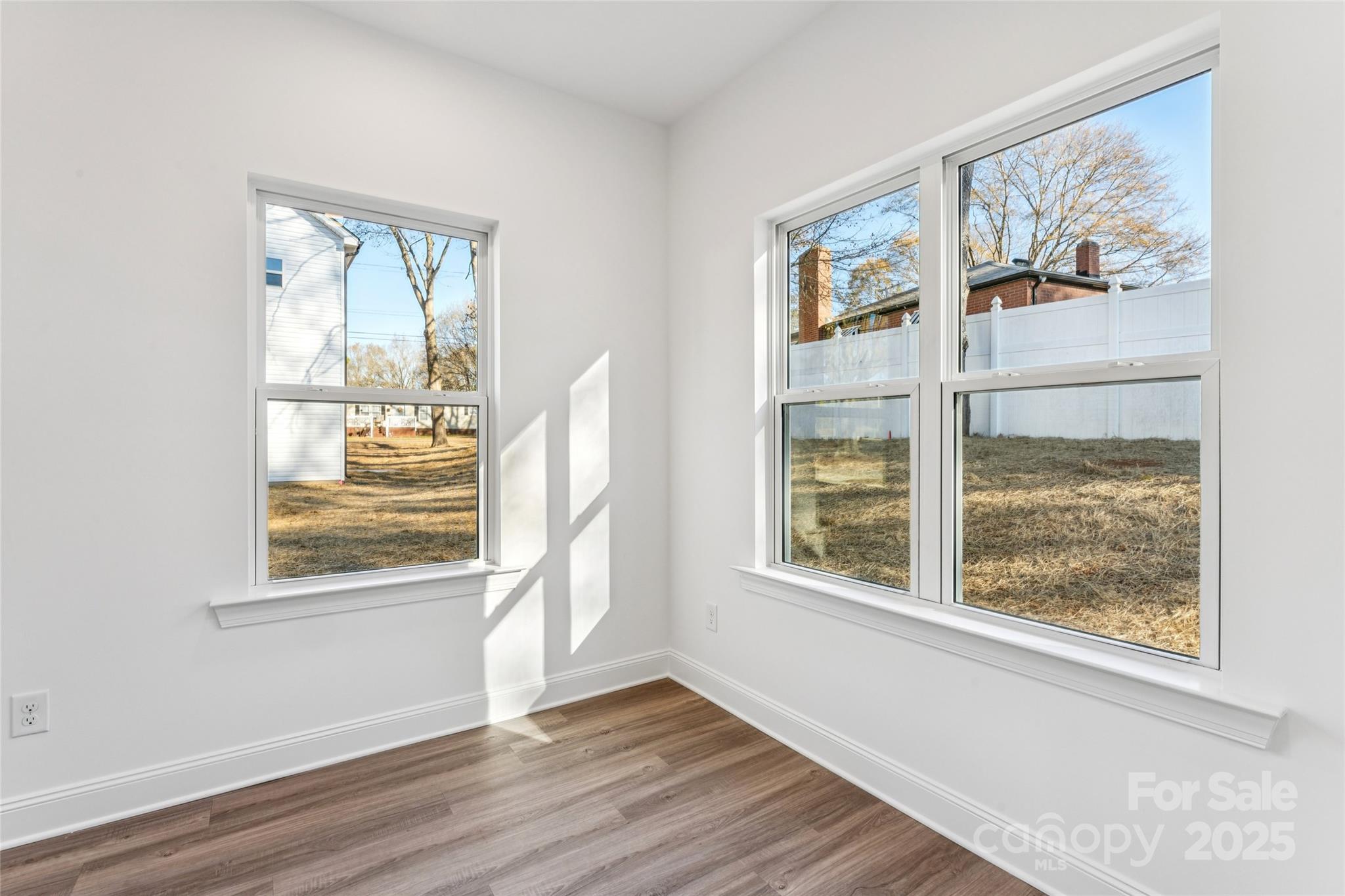 400 South Spargo Street Dallas, NC 28034 - Photo 13 of 26 a view of an empty room with wooden floor and a window