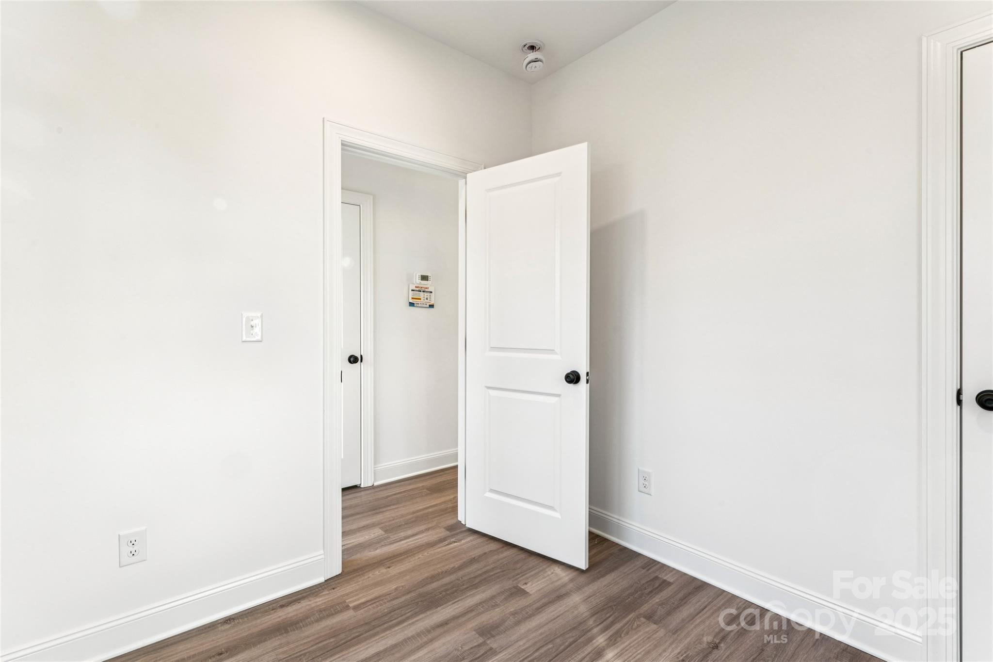 400 South Spargo Street Dallas, NC 28034 - Photo 14 of 26 a view of a hallway with wooden floor