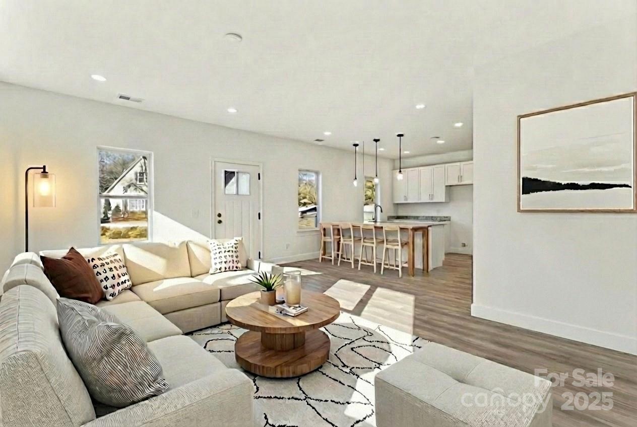 400 South Spargo Street Dallas, NC 28034 - Photo 2 of 26 a living room with furniture and a view of kitchen