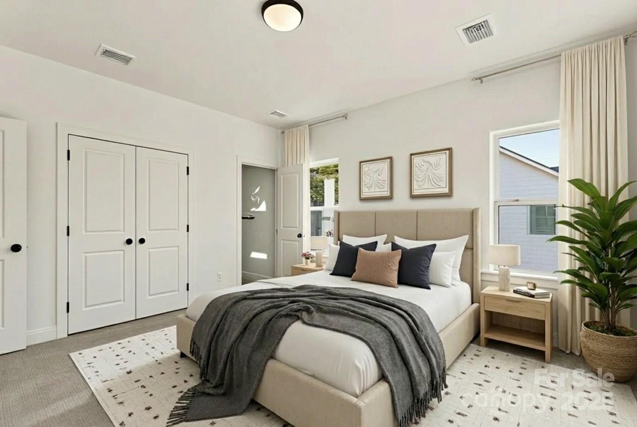 400 South Spargo Street Dallas, NC 28034 - Photo 3 of 26 a bedroom with a bed and a potted plant