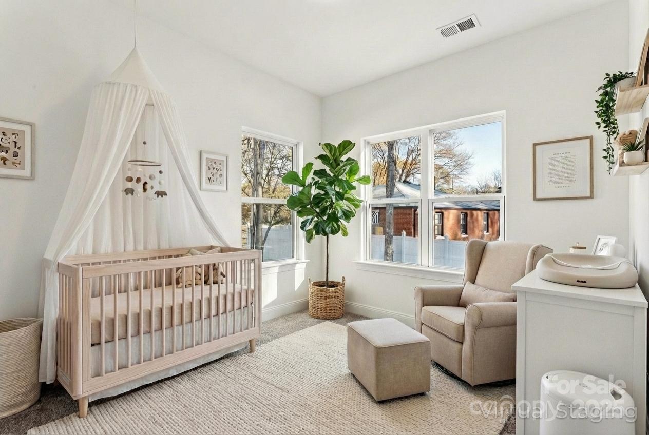 400 South Spargo Street Dallas, NC 28034 - Photo 4 of 26 a living room with furniture and a baby crib