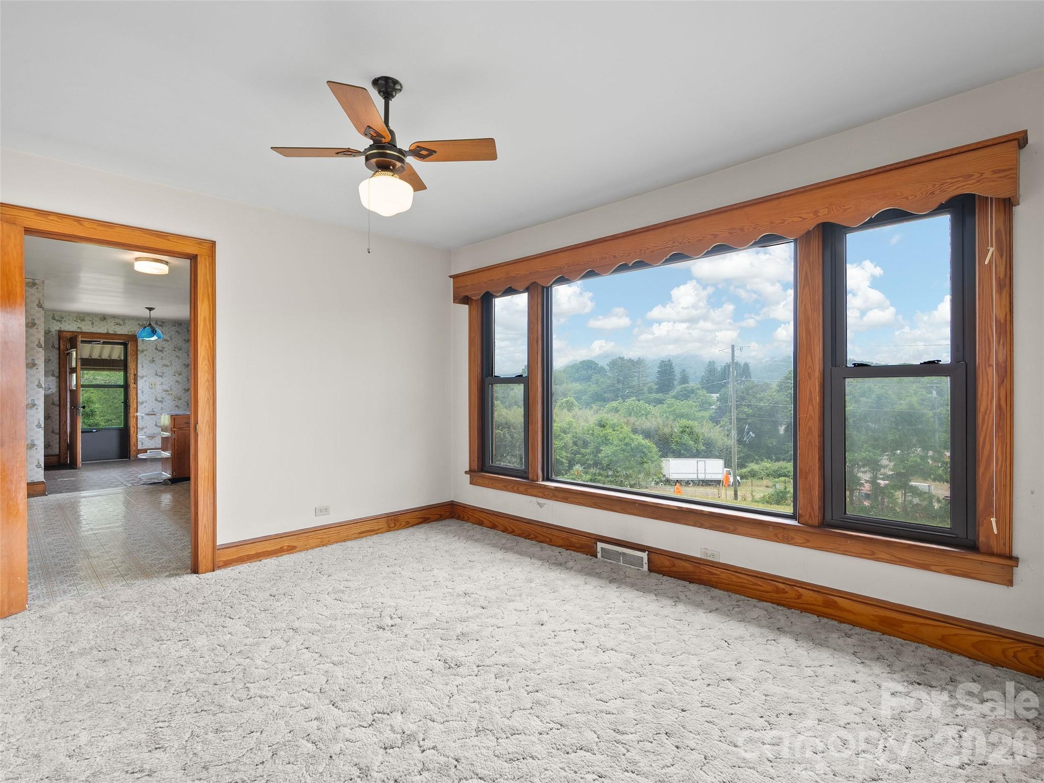 21 Beaverdam Road Canton, NC 28716 - Photo 11 of 24 a view of a livingroom with a ceiling fan and a large window