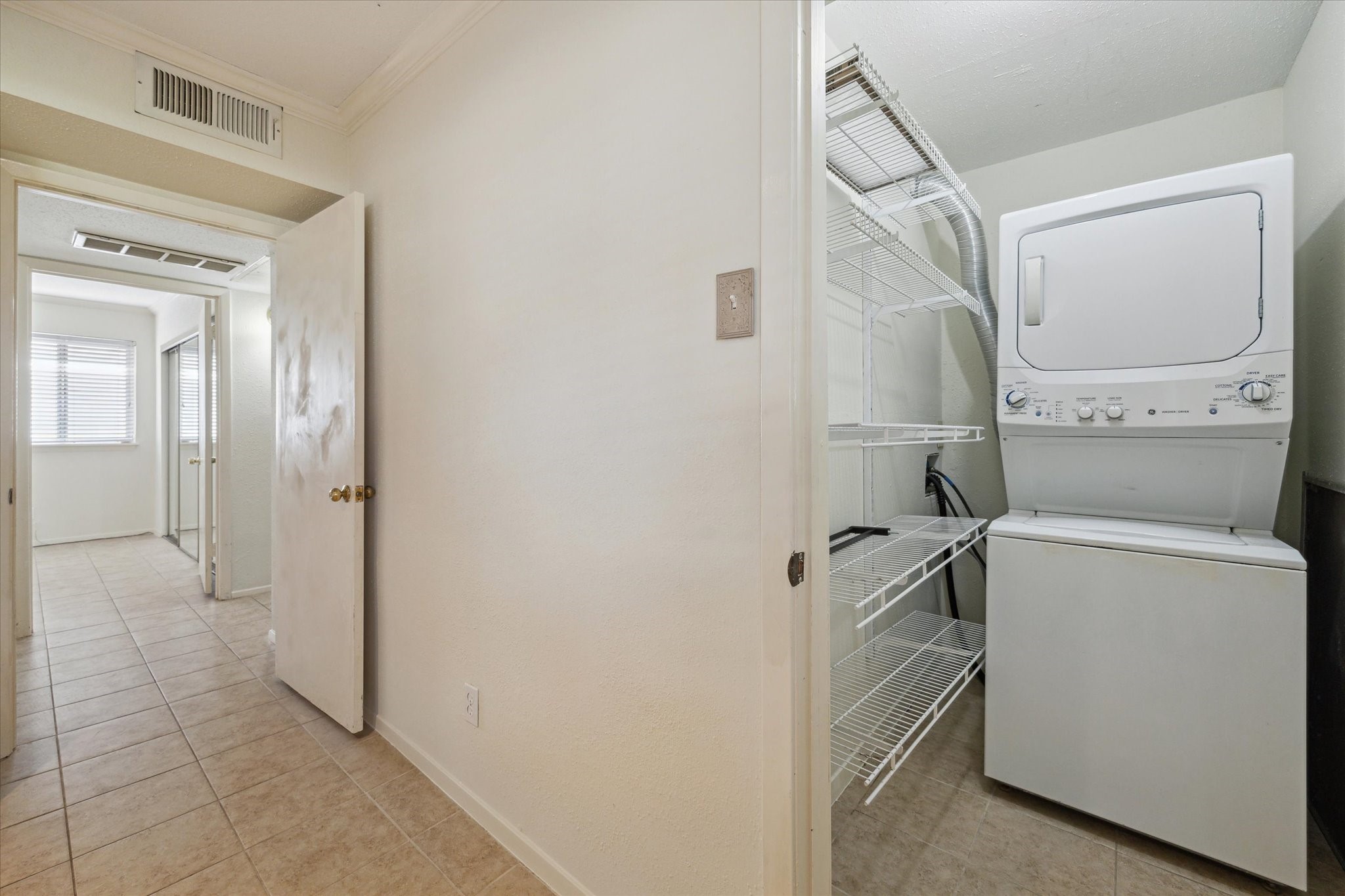 4040 San Felipe Street, Unit 135 Houston, TX 77027 - Photo 16 of 17 a view of a storage & utility room with a washer dryer