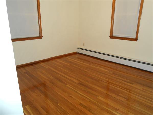 23 Varney Street Springfield, MA 01108 - Photo 6 of 10 a view of an empty room with wooden floor