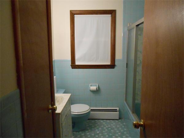 23 Varney Street Springfield, MA 01108 - Photo 7 of 10 a white toilet sitting next to a bathroom sink