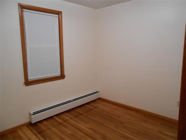 23 Varney Street Springfield, MA 01108 - Photo 8 of 10 a view of empty room with wooden floor