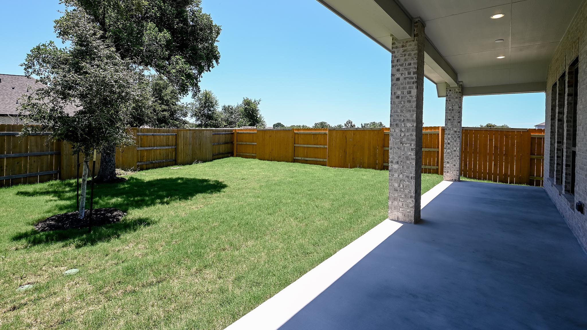126 Basket Flower Loop Kyle, TX 78640 - Photo 22 of 29 a view of a garden with an empty space