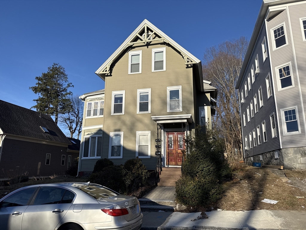 26 Lee Street Worcester, MA 01602 - Photo 1 of 4 a front view of a house with a yard