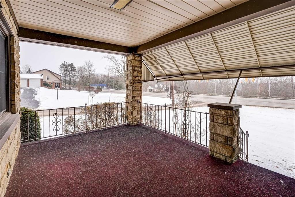 1231 North Main St Extension Butler, PA 16001 - Photo 13 of 15 Covered side porch that adds outdoor space for all of the seasons.