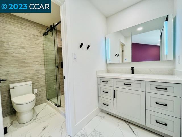 118 Lawnview Circle Danville, CA 94526 - Photo 28 of 50 a bathroom with a toilet sink vanity and mirror