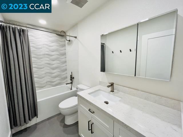 118 Lawnview Circle Danville, CA 94526 - Photo 36 of 50 a bathroom with a toilet a sink and a mirror