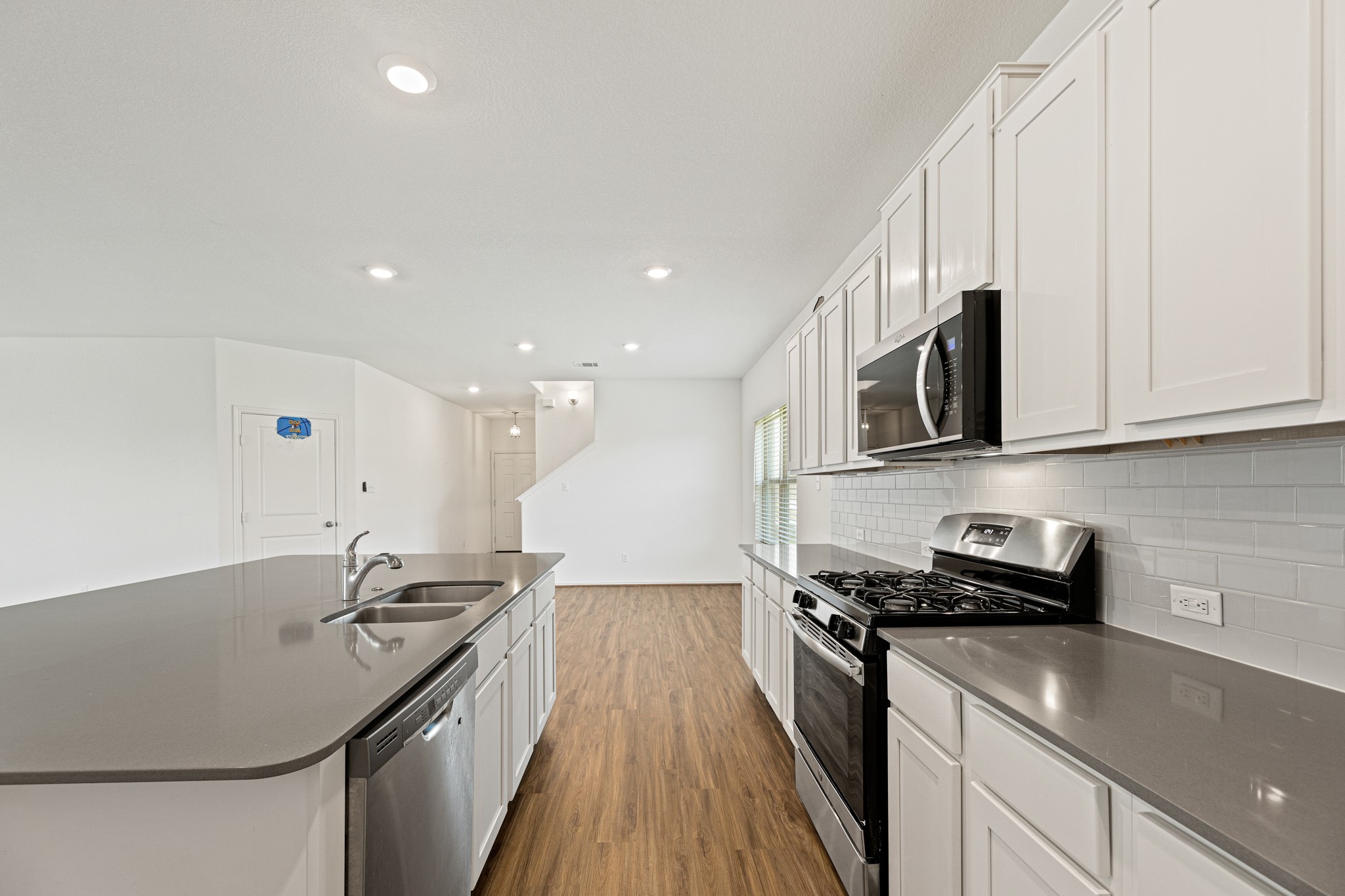 21317 Resource Road Pflugerville, TX 78660 - Photo 10 of 37 A well-appointed kitchen showcasing contemporary appliances and abundant counter space for culinary endeavors.