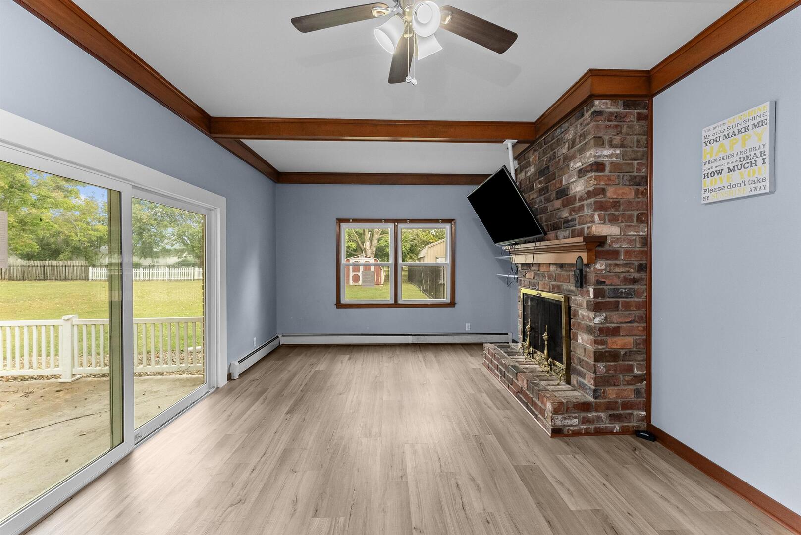 305 North Henderson Road Alexis, IL 61412 - Photo 13 of 31 a view of empty room with fireplace and wooden floor